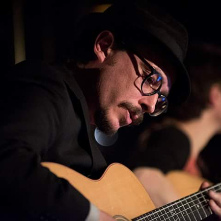 Picture of Marc Wencelius playing alongside Christine Tassan during the event Les Nuits Gitanes part of Nuits d'Afrique. Musicos Productions. Photo credited to Peter Graham